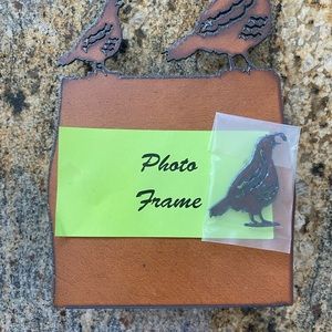 Rusted metal photo holder with quail adornment